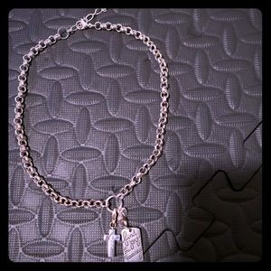 Sterling silver necklace with two charms.